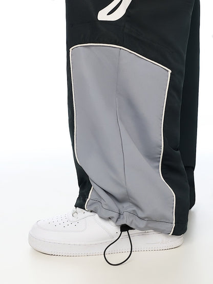 HS LOGO BAGGY NYLON PANTS