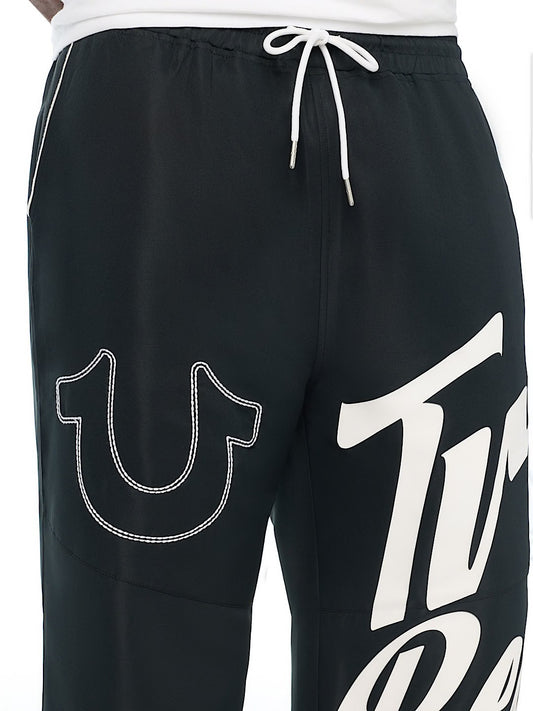 HS LOGO BAGGY NYLON PANTS