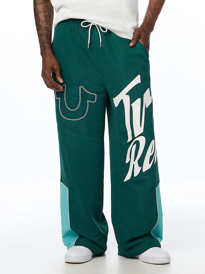 HS LOGO BAGGY NYLON PANTS